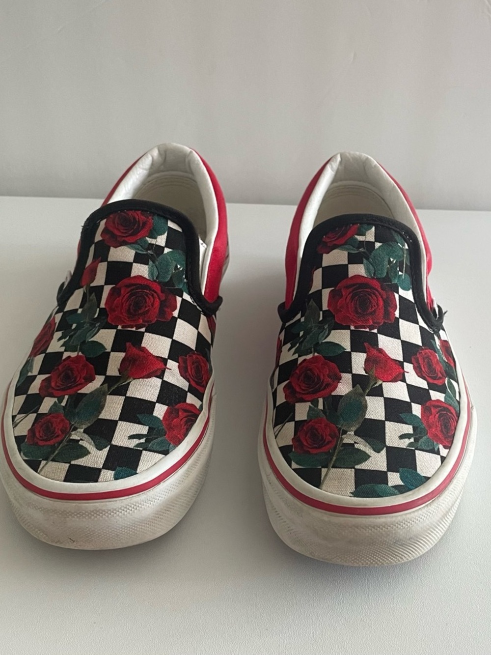 Vans Kids Slip-On Sneakers in Black, White, Red and Green Rose Print